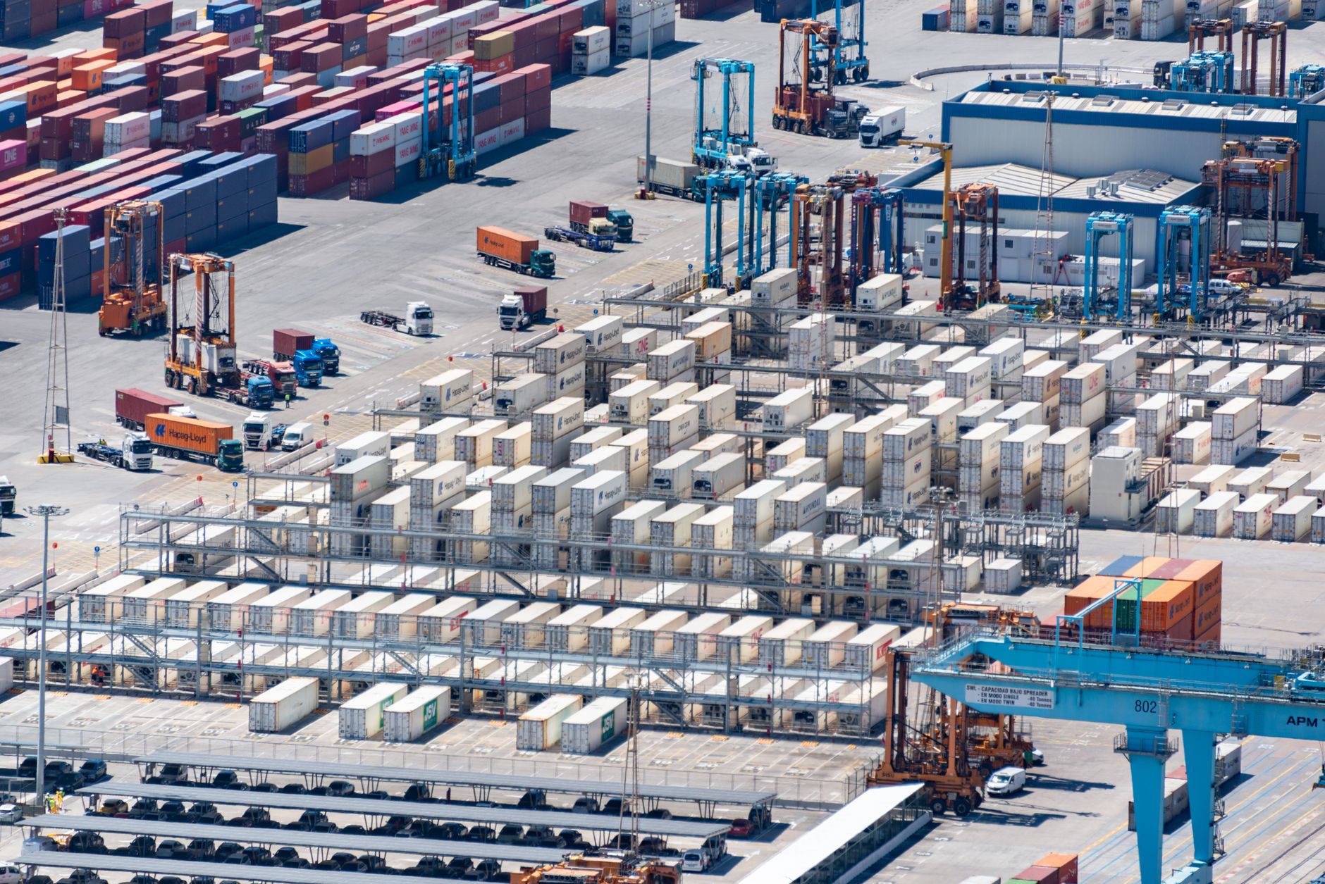 Container port terminal with gantry cranes and stacked containers