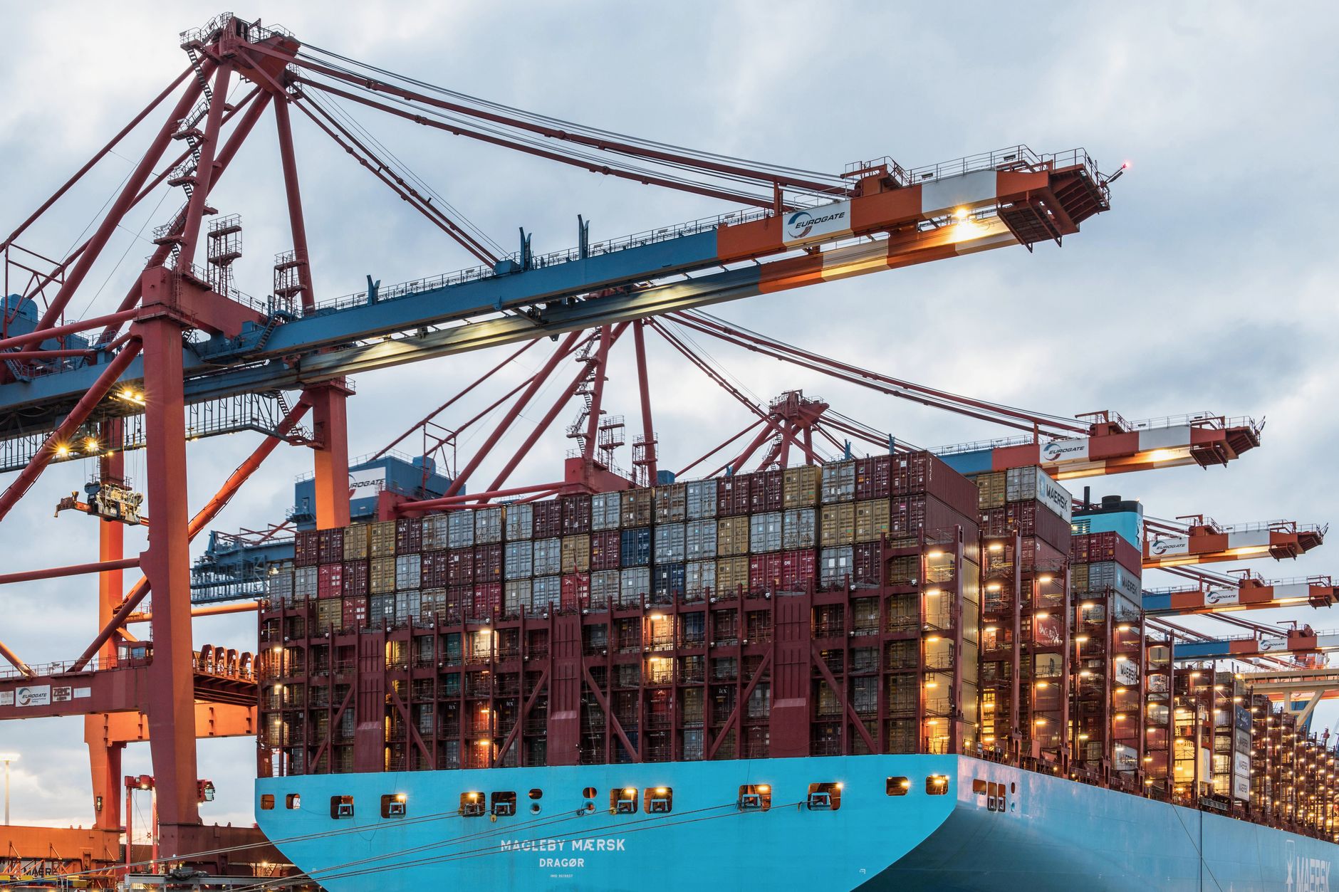 Gantry cranes loading a container ship at a port