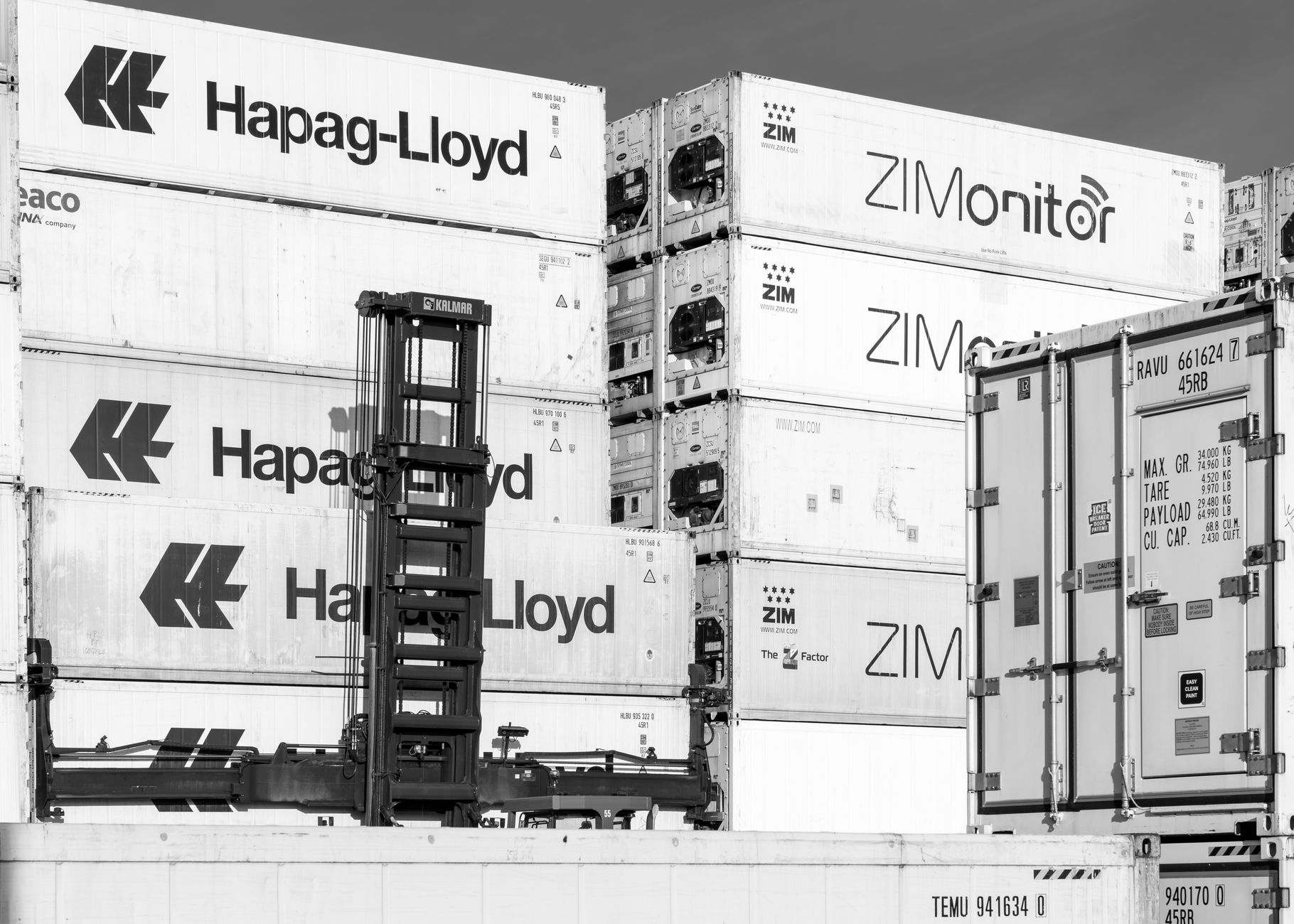 A stack of refrigerated reefer shipping containers