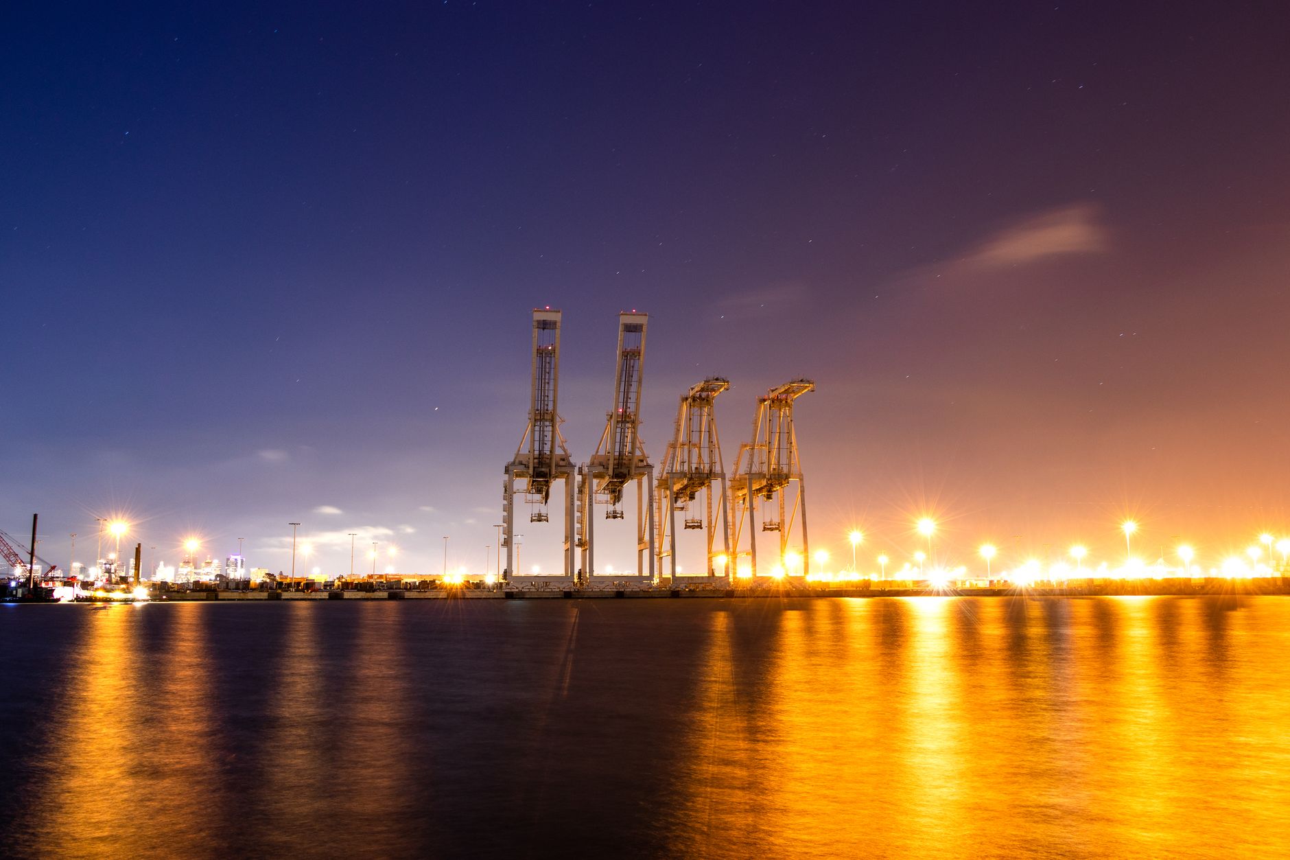 Container port cranes at night