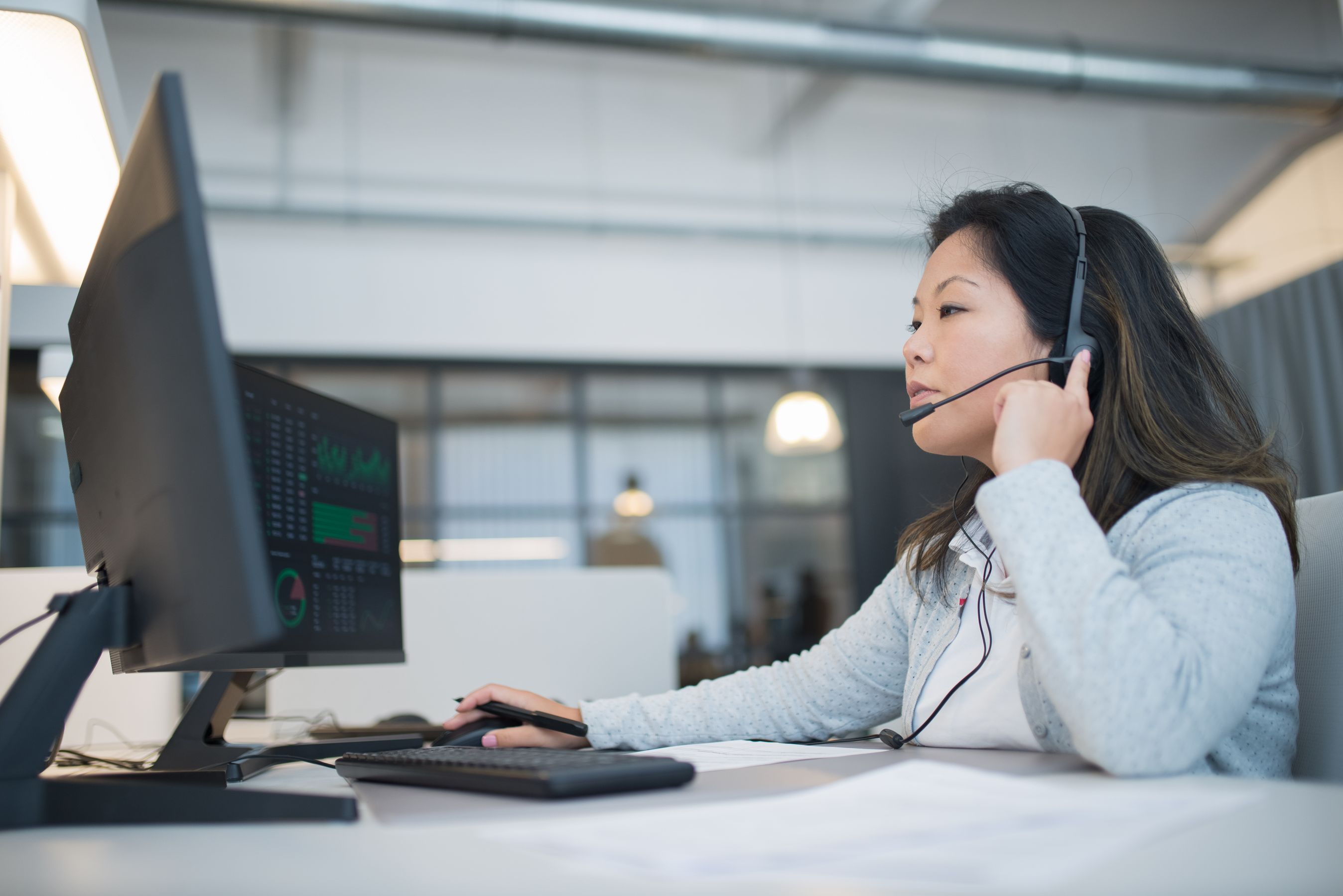 EU customs data centre with officers reviewing shipment records on screens