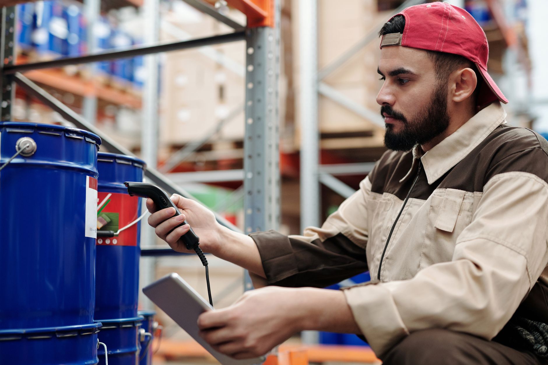 A worker scanning a product barcode in a warehouse
