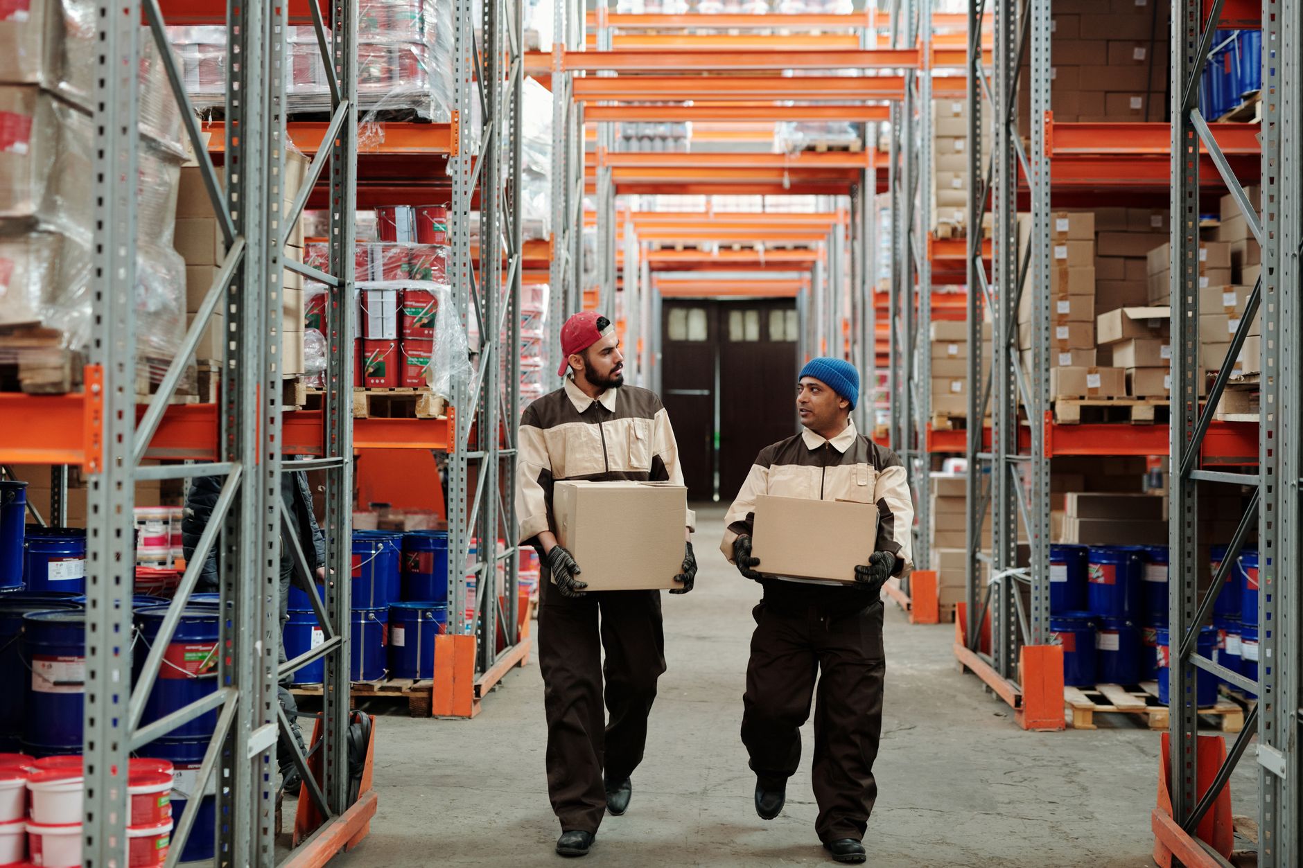 Warehouse workers moving parcels for dispatch