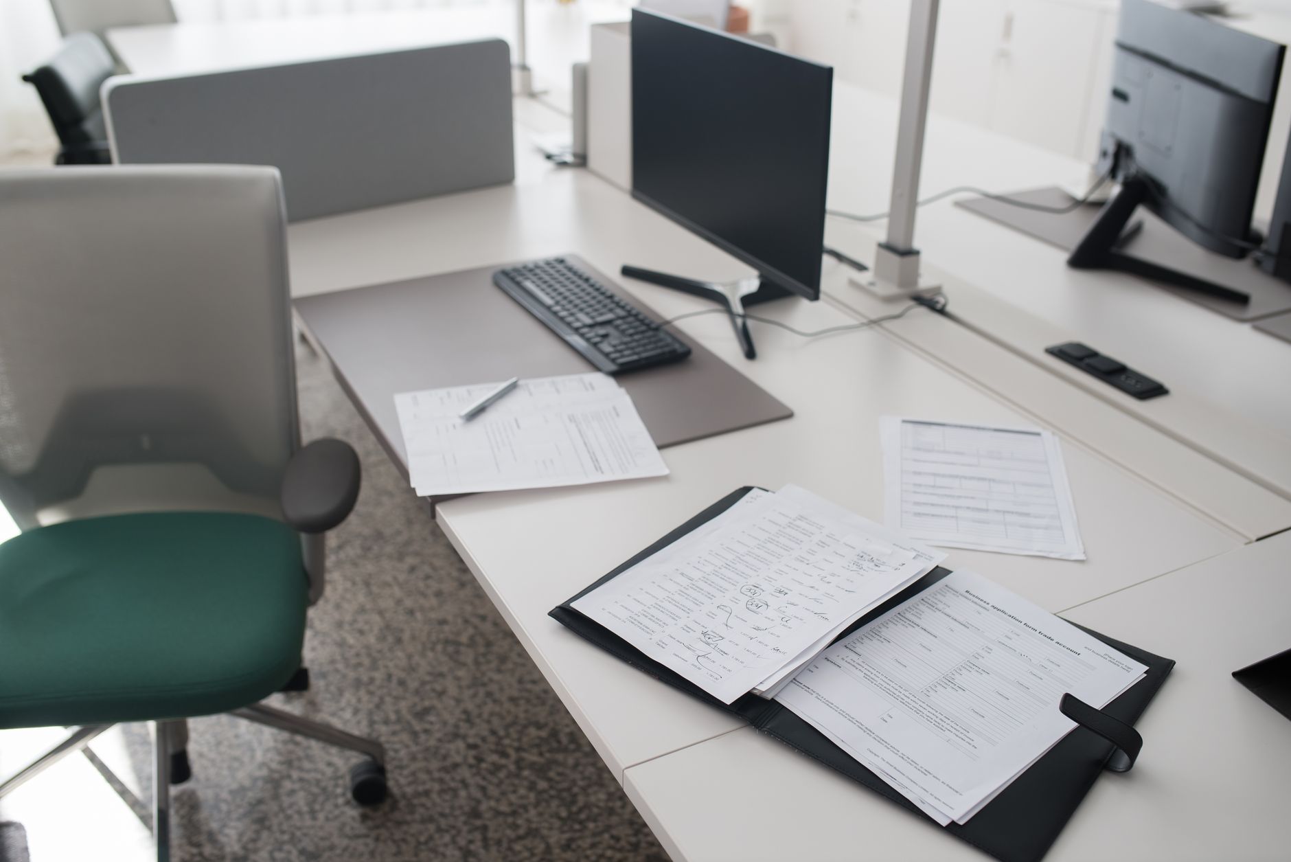 Office desk with trade account forms and paperwork, the records an importer of record keeps five years