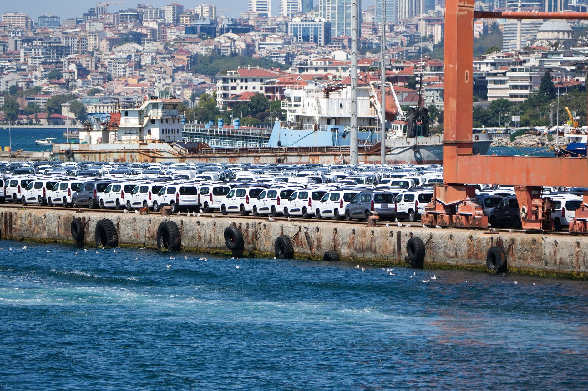 Imported cars staged on a quay at a vehicle shipping port