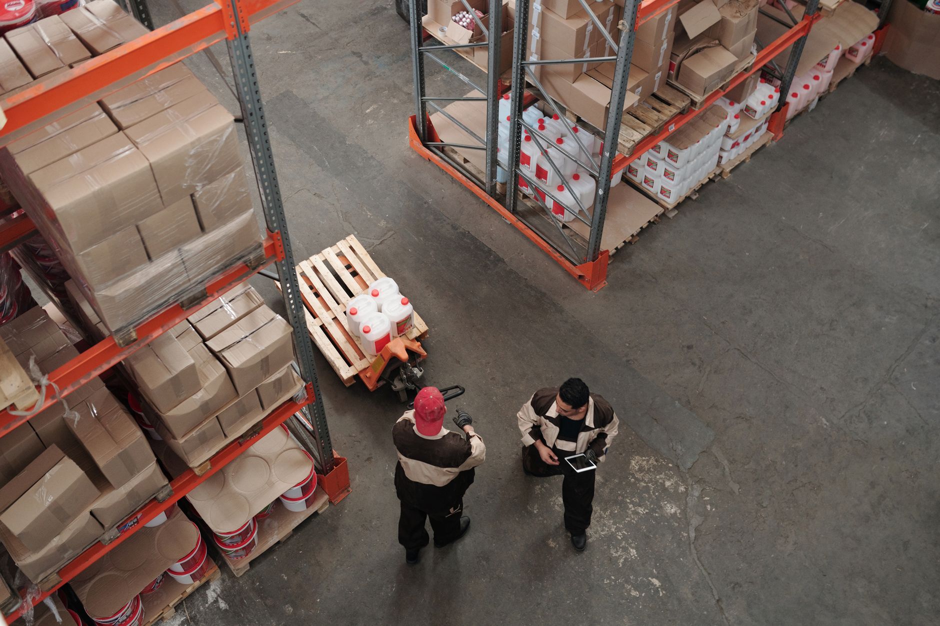 Freight forwarder warehouse with stacked shipping containers and cargo