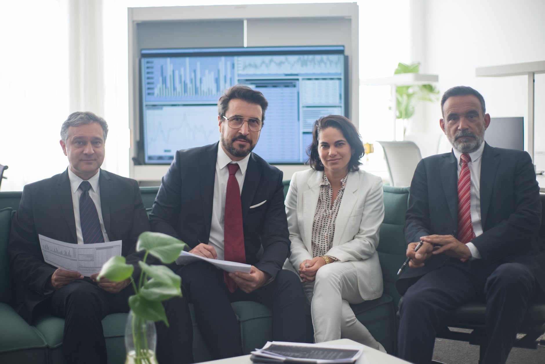 Trade finance team reviewing figures in an office