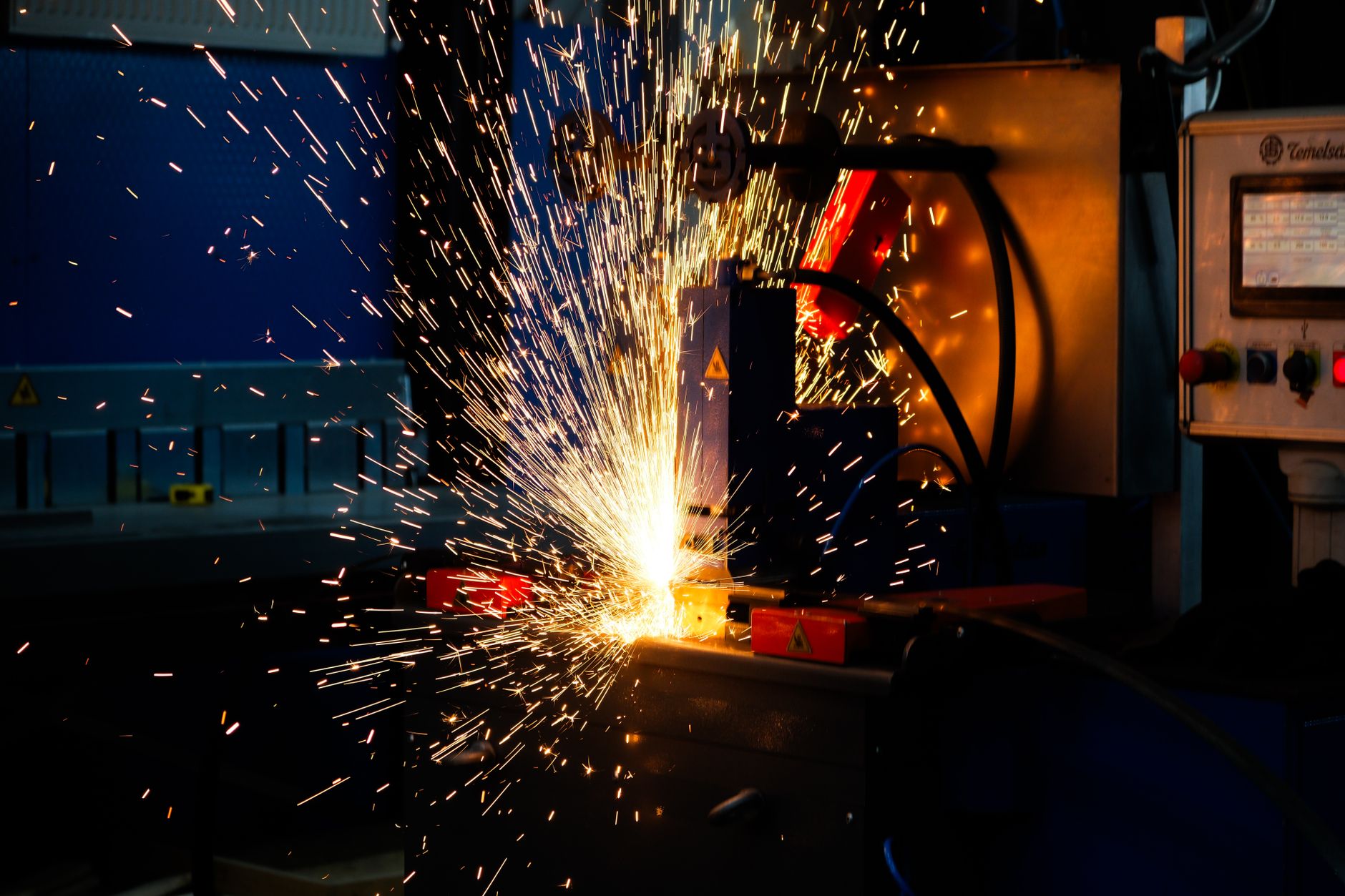 Sparks from an industrial metal-cutting machine