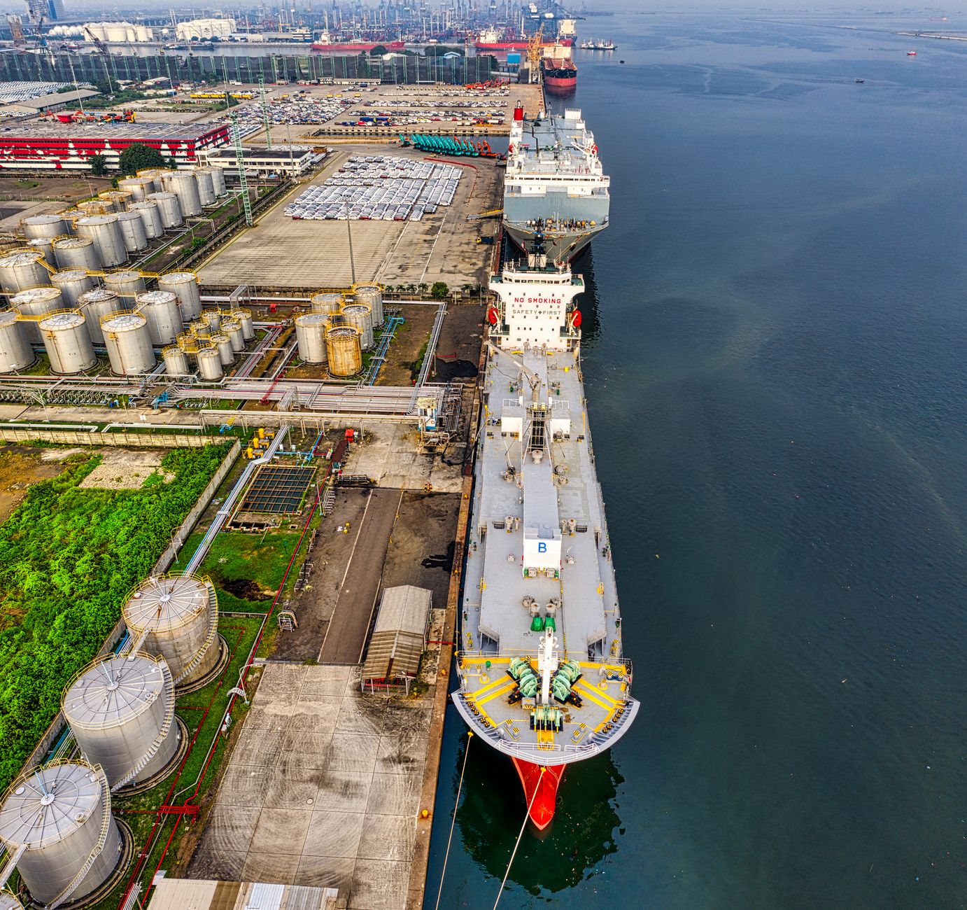 Aerial view of an oil tanker docked at a loading terminal