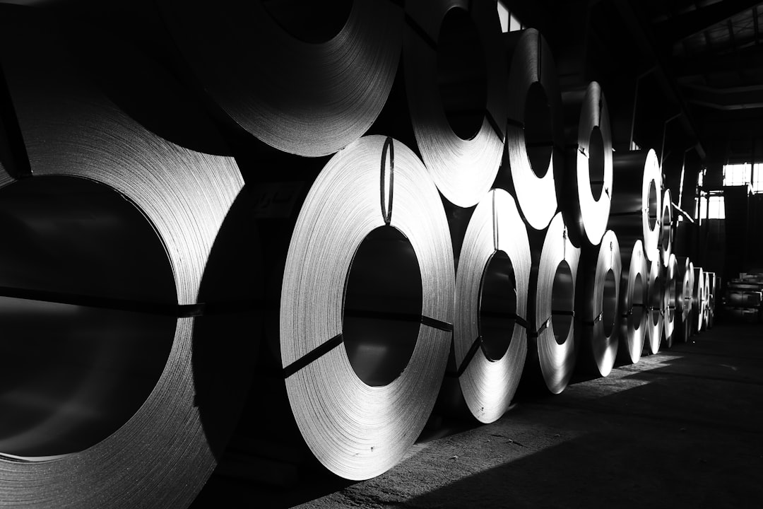 Rolls of steel stacked in a warehouse