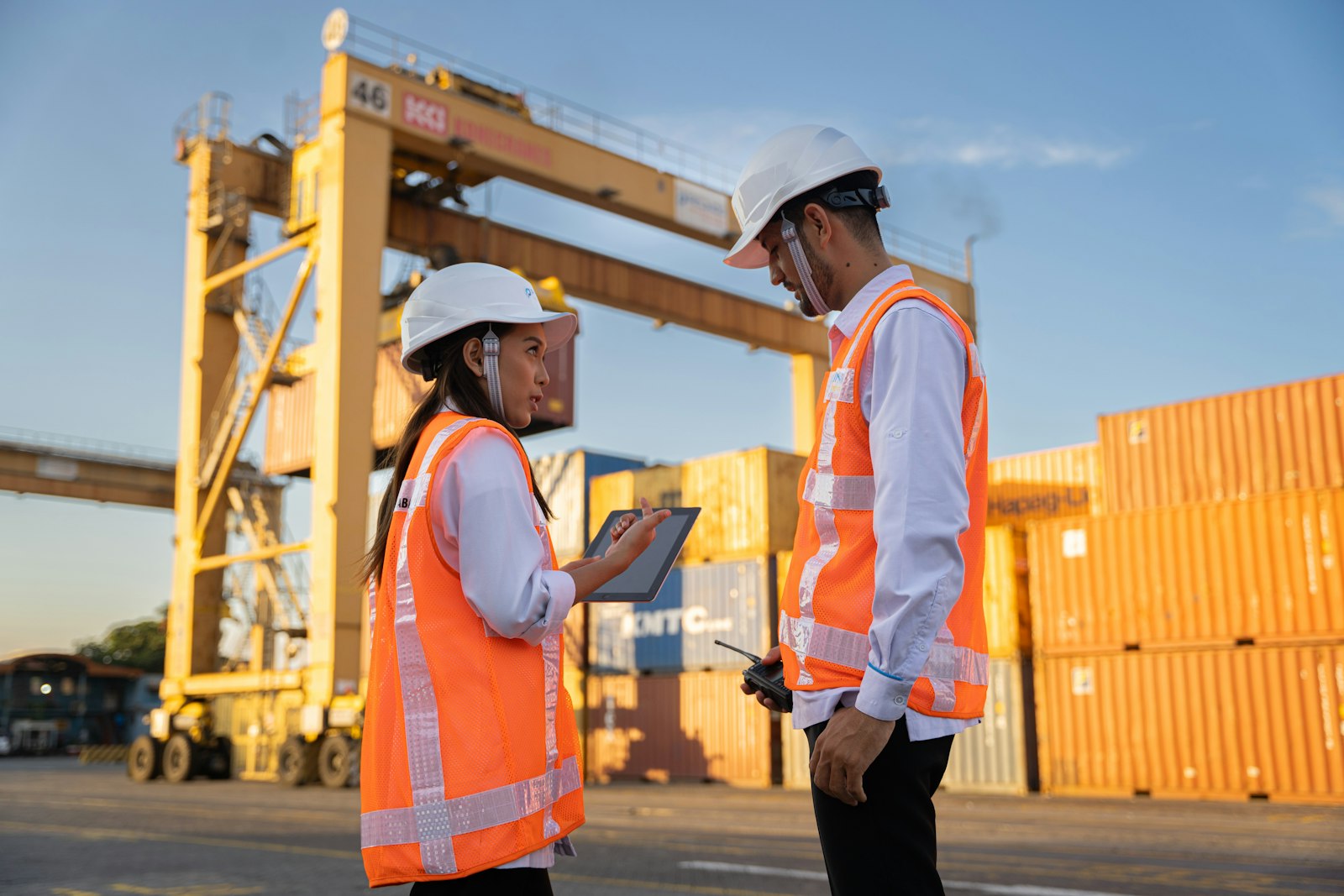 US customs officers inspecting import cargo at a port of entry
